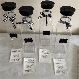 Set of 4 Clear plastic Bottles with Black Lids and Ribbons food laundry pantry